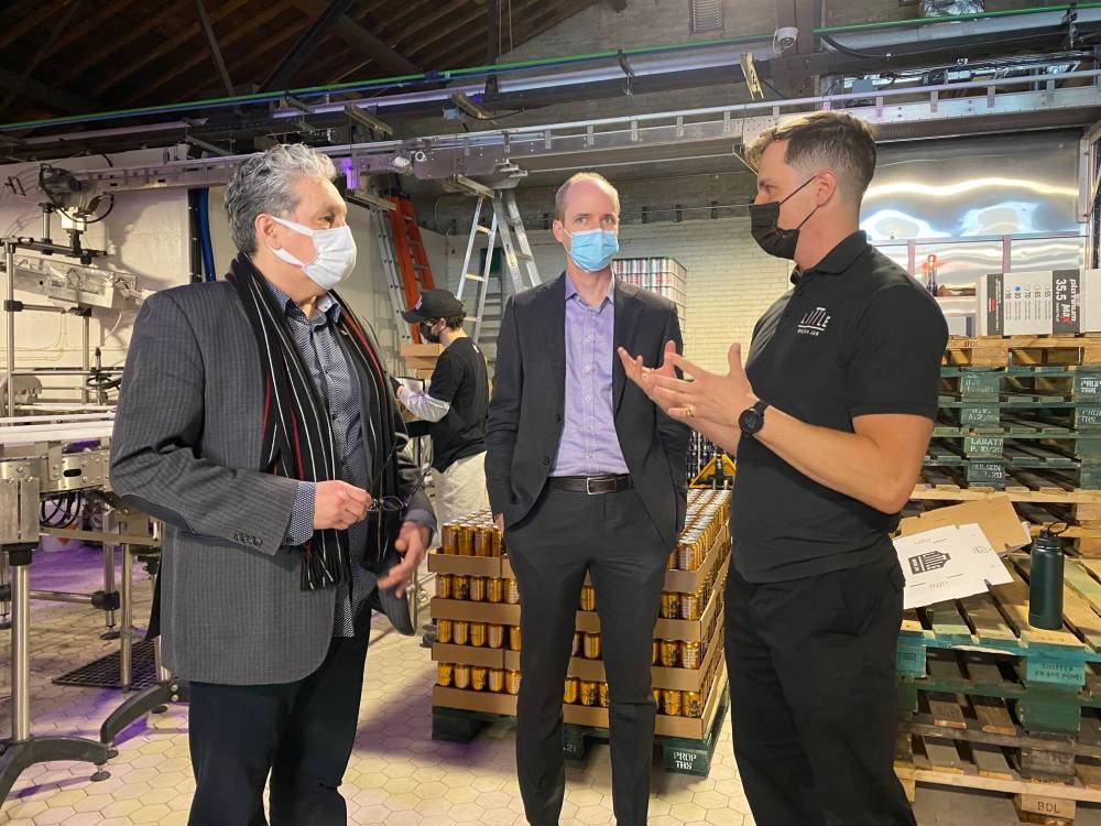 Ben Sigurdson / Winnipeg Free Press
Little Brown Jug founder Kevin Selch (right) gives a brewery tour to Dan Vandal (left), the minister responsible for Prairies Economic Development Canada, and assistant deputyminister Sean Barr.