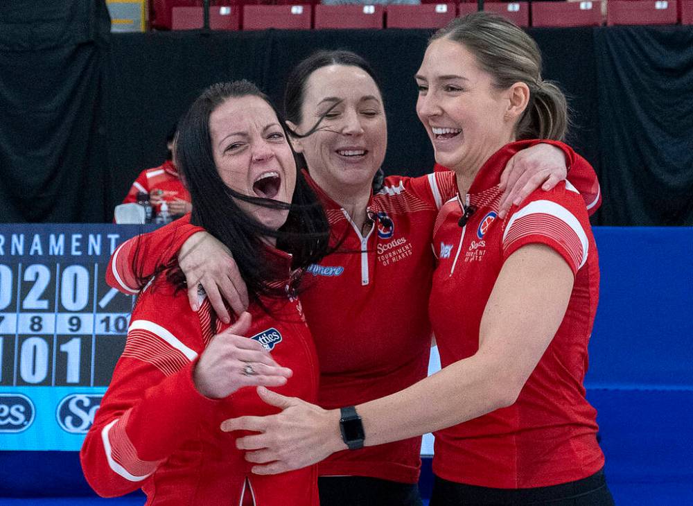 Kerri Einarson (from left), Val Sweeting and Briane Meilleur celebrate in February after winning the Scotties. (Andrew Vaughan / The Canadian Press files)