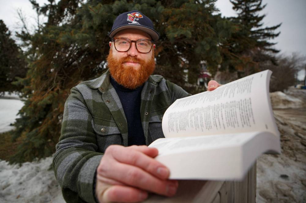 MIKE DEAL / WINNIPEG FREE PRESS Falk with a copy of a Mennonite Low German Dictionary.