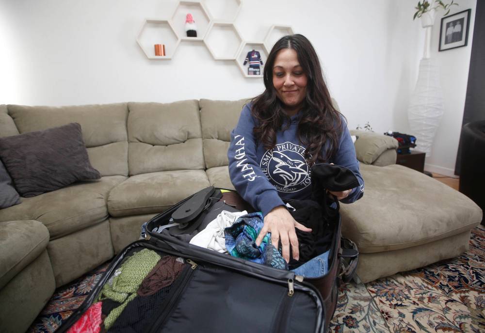 JOHN WOODS / WINNIPEG FREE PRESS
Shakira Whitton packs a bag for her children at her home. Whitton had trouble getting passports for her children who are flying to Mexico Sunday night.