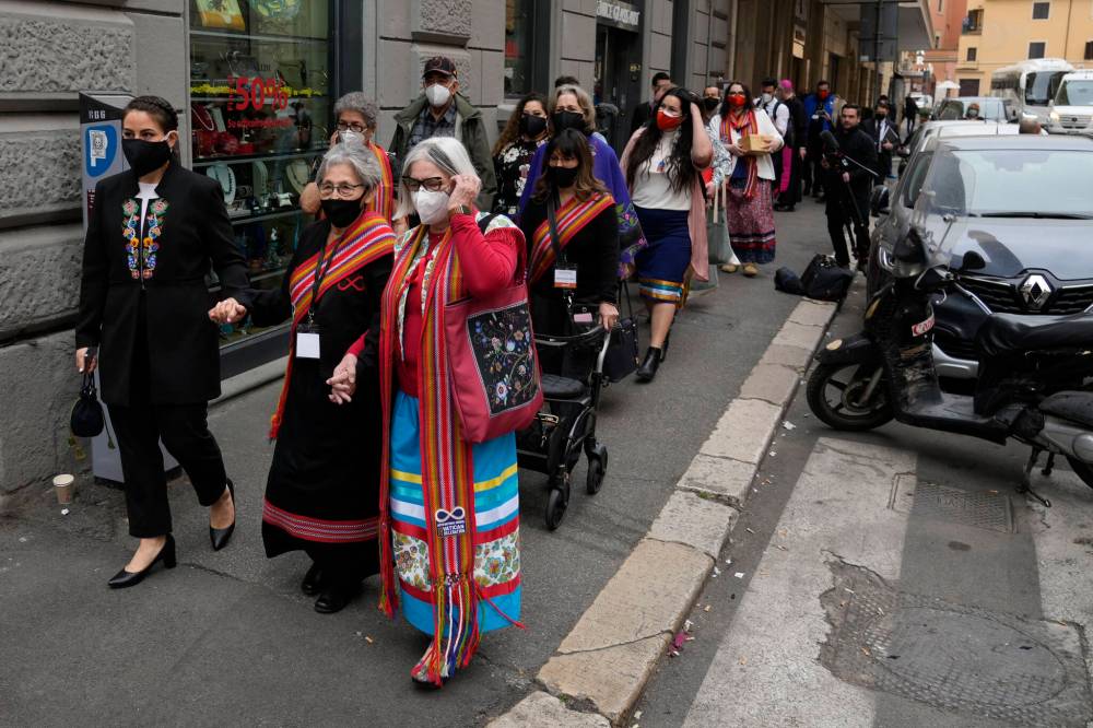 GREGORIO BORGIA / ASSOCIATED PRESS PHOTO
The President of the Metis community, Cassidy Caron, left, leaving the hotel with a Metis National Council delegation to meet with Pope Francis in Rome.