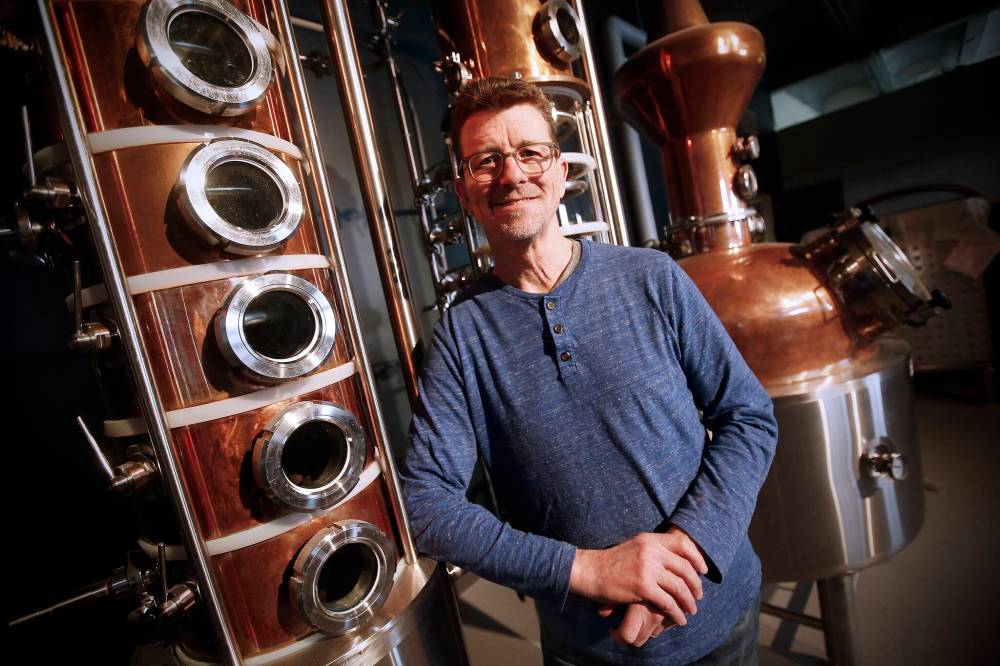 JOHN WOODS / WINNIPEG FREE PRESS
Brock Coutts, co-owner of Patent 5 Distillery, with his still in Winnipeg. Much of the interior decor has been repurposed from the old St Regis Hotel and will be opening soon.
