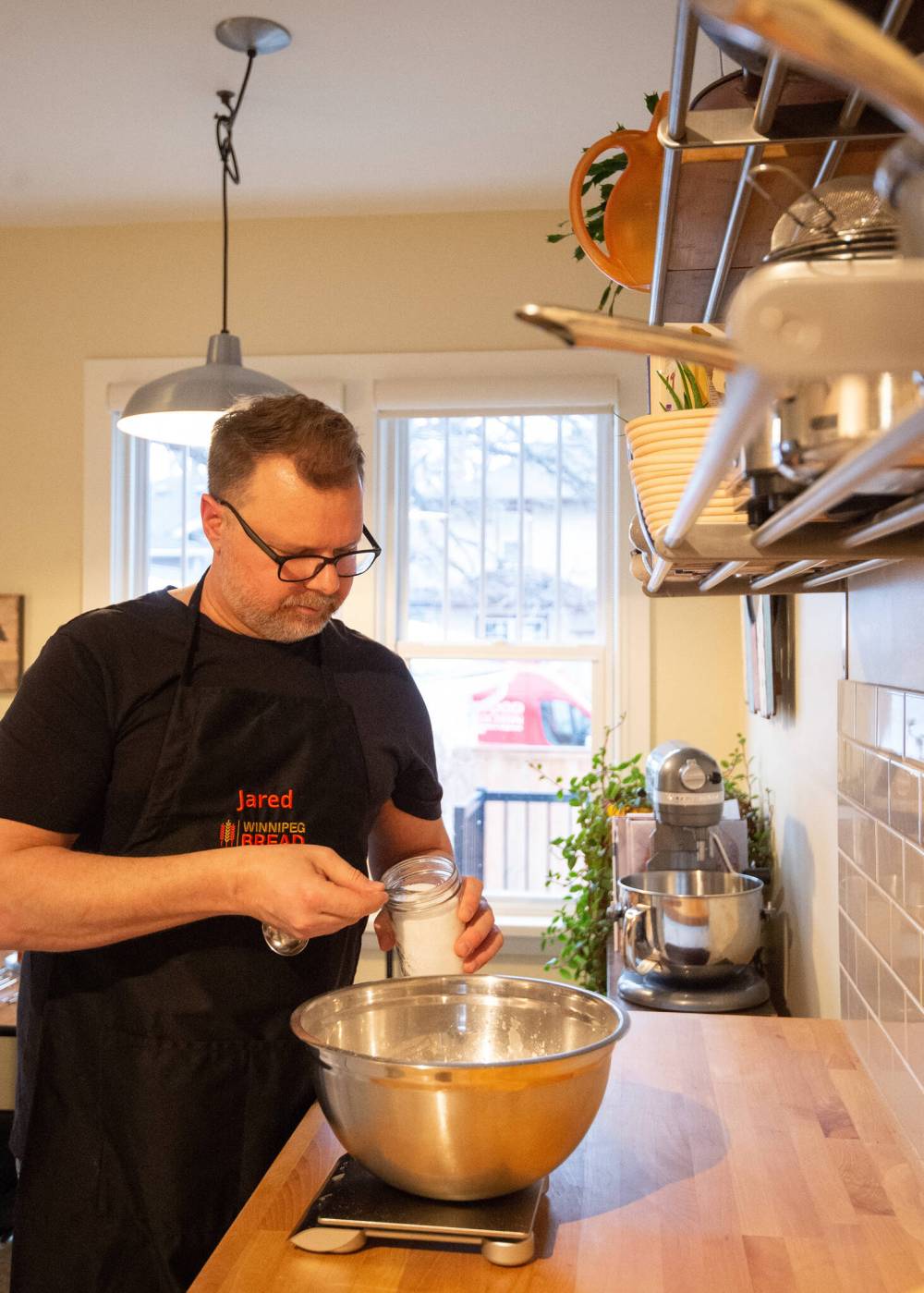 Mike Sudoma / Winnipeg Free Press
Ozuk adds ingredients to a dough recipe in his kitchen.