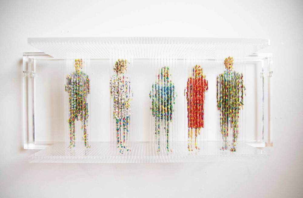 JESSICA LEE / WINNIPEG FREE PRESS
In a work based on photographs of the Davos Forum, the colourful figures look different depending on the angle from which they viewed.