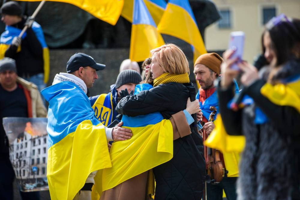 A daily demonstration, which was calling for NATO to close the airspace over Ukraine, takes place in the heart of the old town in Krakow on April 3. (Mikaela MacKenzie / Winnipeg Free Press)