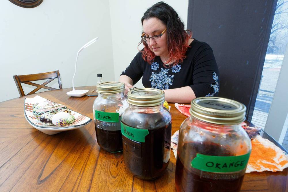 Jars of dye sit ready for use. Rossier usually works on a few pysanka at a time.