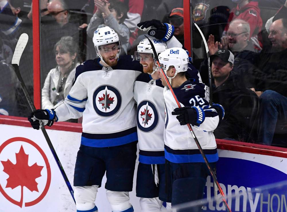 Pierre-Luc Dubois (from left), Kyle Connor and Paul Stastny (Justin Tang / The Canadian Press files)