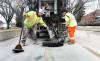 RUTH BONNEVILLE / WINNIPEG FREE PRESS
Street work City crews fill potholes with a tar mixture along Burrows Ave. It was unclear how many calls involved pothole damage because CAA Manitoba doesn’t track the statistic.