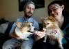 JOHN WOODS / WINNIPEG FREE PRESS Owners of Woof Doughnuts Kerner Pieterse and Kim Frobisher, treat their dogs Nubi, 3, left, and Coco, 5, to a “The Canuck” doughnut.