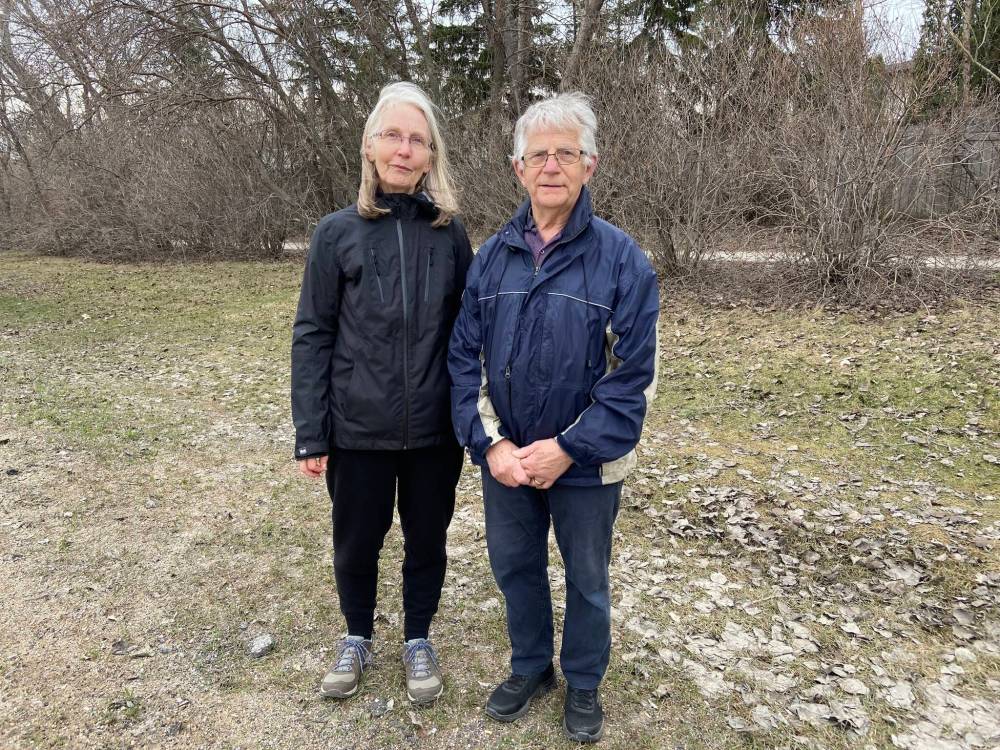 Bob and Penny Miller have lived in the area for 20 years and have never seen the potholes this bad. (Malak Abas / Winnipeg Free Press)