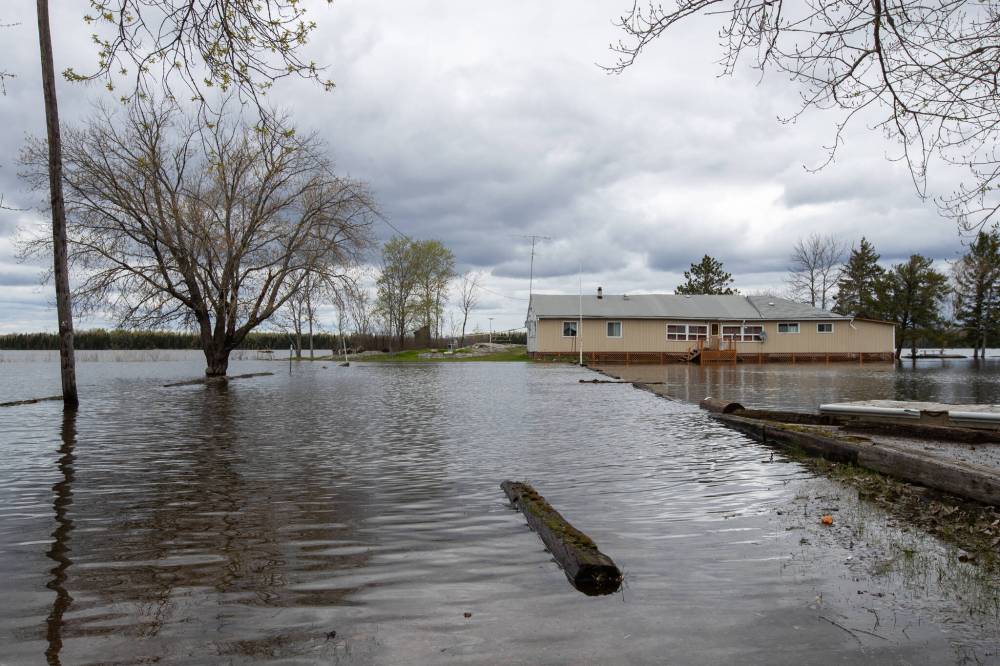 A cabin on Eleanor Lake off of Provincial Road 307 is surrounded by flood waters. (Daniel Crump / Winnipeg Free Press)