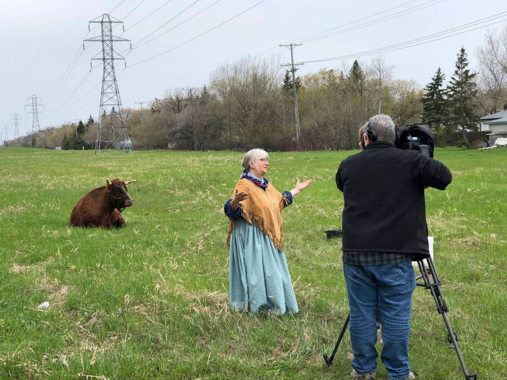 TERRY DOERKSEN
Patty Doerksen speaks to media while Zik takes a breather on a south Winnipeg greenway.