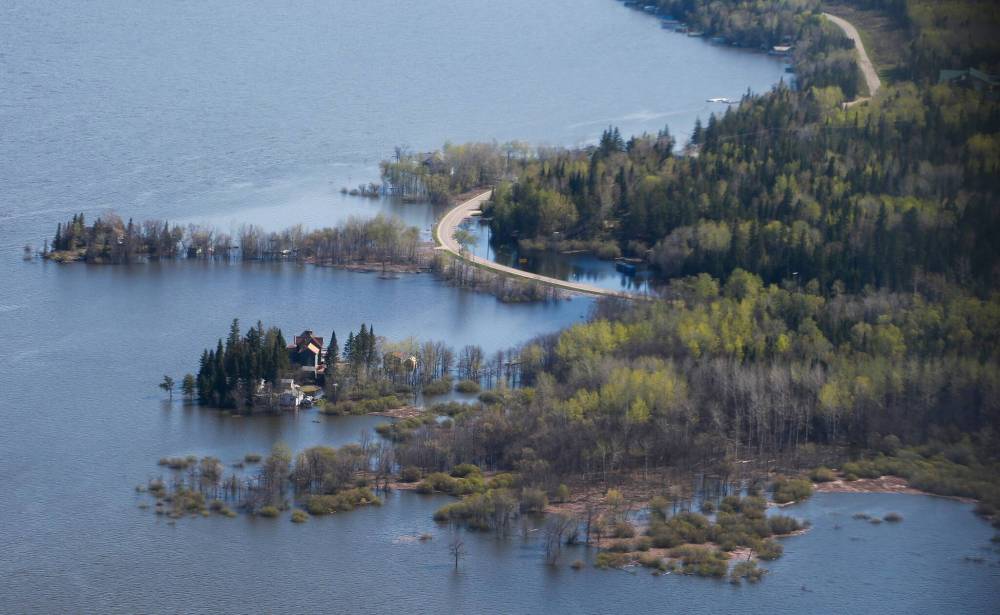 JOHN WOODS / THE CANADIAN PRESS
Some Whiteshell lakes are expected to rise by up to another foot in the next 10 to 14 days, with a lot of water still to drain into the Winnipeg River in northwestern Ontario.