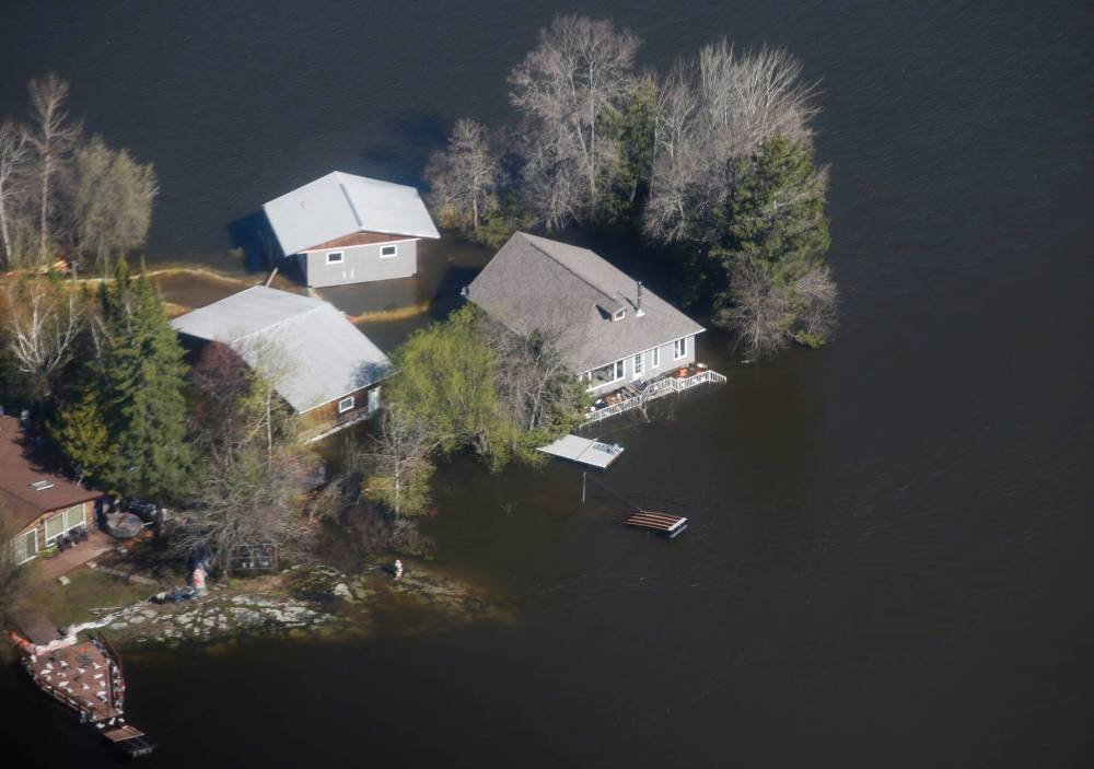 JOHN WOODS / THE CANADIAN PRESS
Ray and Lori Bilevicius, who have a cottage at Barrier Bay, are worried they will find it sitting in water when owners are allowed to return. The evacuation order is in effect until at least June 6.