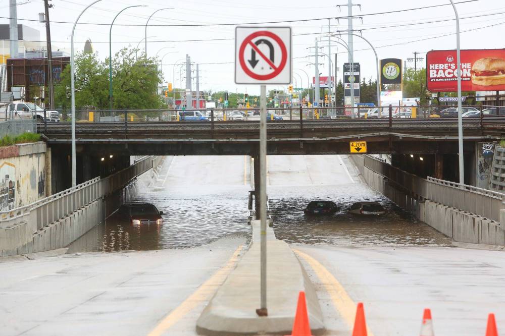 MIKE DEAL / WINNIPEG FREE PRESS
The McPhillips Street underpass just north of Logan Avenue is flooded by rainwater on Tuesday morning.