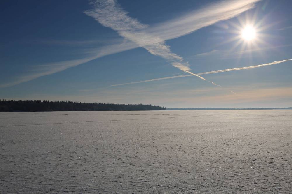 Frozen Clear Lake awaits ice fishers. For any early ice trip, caution is a must-fish with at least one other person and check ice constantly. (Don Lamont / Winnipeg Free Press)