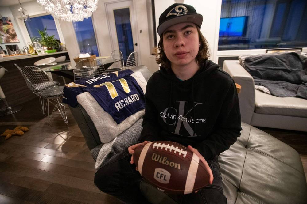 Daniel Crump / Winnipeg Free Press.
AJ Boyko holds the ball that nearly hit him on Saturday during the CFL west division when a Saskatchewan Roughriders player allegedly threw the ball into the crowd in an attempt to hit a heckling fan.