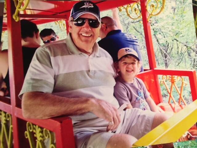 Submitted
Dave, decked out in support of his favourite football team, takes a train ride with grandson Ivan at Assiniboine Park. David Frayer was a prominent federal Crown attorney in his career, but after hours he was a wonderful family man, a great friend to many, and a lover of music.