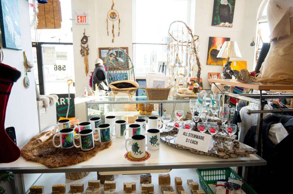 Mike Sudoma / Winnipeg Free Press Proulx’s shop is home to all kinds of hand crafted pieces such as dream catchers, moccasins, carvings, and traditional clothing items made to fit. December 13, 2021