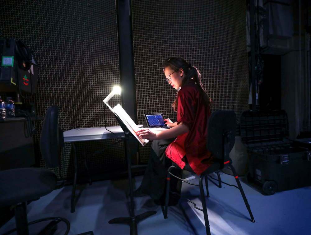 Woo inputs information into the symphony's EnCue app. (Ruth Bonneville / Free Press files)