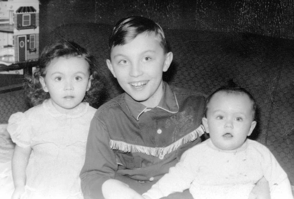 SUPPLIED
Kisil (centre) and his siblings Linda (left) and Rick in 1957.