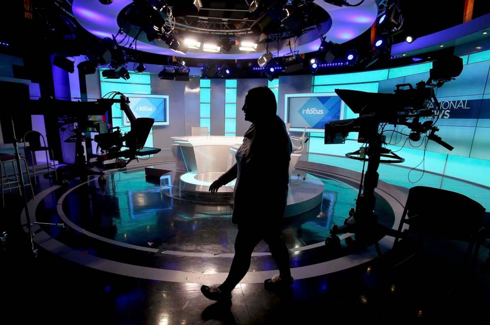 Associate director Charmaine Straker walks though a studio at the Aboriginal Peoples Television Network. (Shannon Vanraes / Winnipeg Free Press)