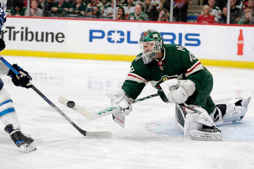 Minnesota Wild goalie Deva Dubnyk makes a save against Winnipeg Jets left wing Nikolai Ehlers (27) in the second period. (Andy Clayton-King/The Associated Press)