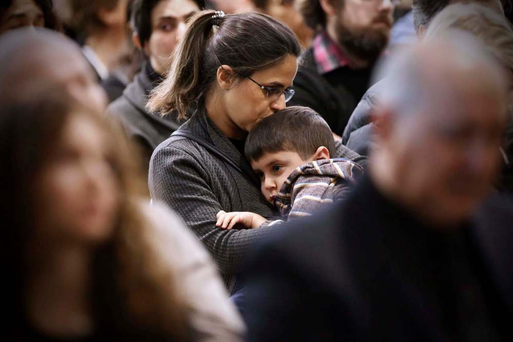 JOHN WOODS / WINNIPEG FREE PRESS
A young child is hugged during the service.