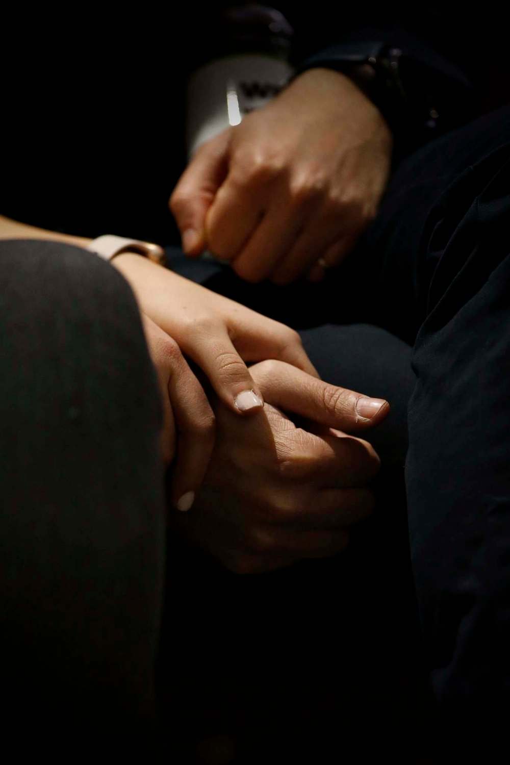 JOHN WOODS / WINNIPEG FREE PRESS
A couple holds hands during the service.