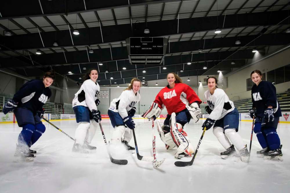 Aimee Patrick (from left), Kate Bumstead, Gabi Dawyduk, Meagan Relf, Lainie Nichols and Chloe Oleksiak are all graduating with scholarships to play hockey at the university level next season. (Daniel Crump / Winnipeg Free Press)