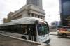 MIKE DEAL / WINNIPEG FREE PRESS A Winnipeg Transit bus travels through the intersection of Portage Avenue and Main Street Thursday afternoon. 190328 - Thursday, March 28, 2019.
