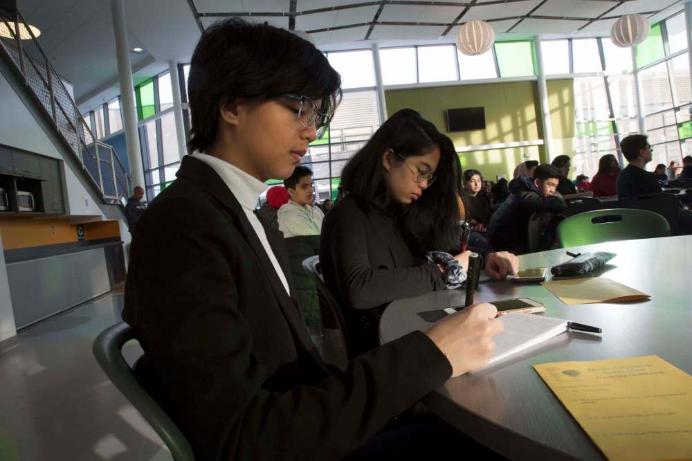 Maples Met students Rory Ramos (left) and Alex Payawal at the Seven Oaks Global Citizenship Conference. (Melissa Martin / Winnipeg Free Press)