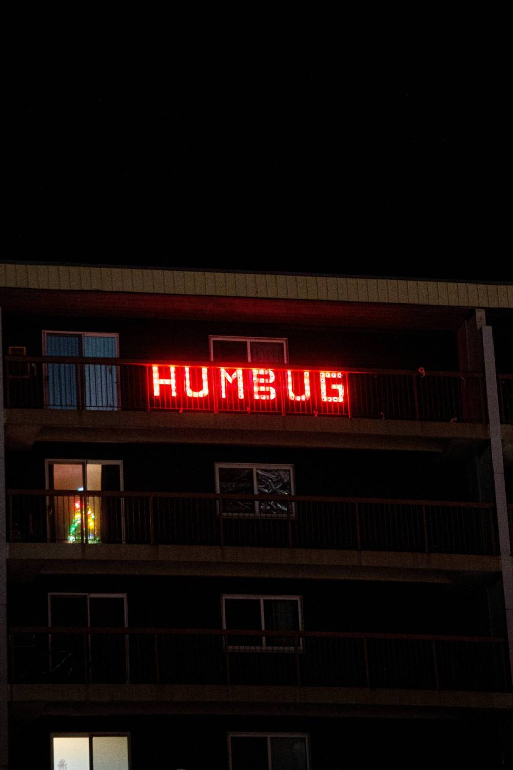 Mike Sudoma / Winnipeg Free Press
Sidney (Sid) Farmer thought it would be funny, a little ironic, to put that word up on his balcony.