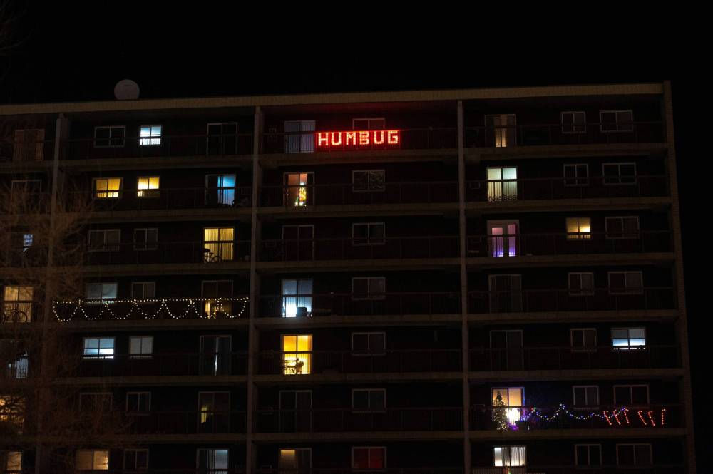 Mike Sudoma / Winnipeg Free Press
Sidney (Sid) Farmer’s infamous “Humbug” light display still shines brightly from his former apartment’s balcony, which faces the Route 90 underpass near Polo Park.