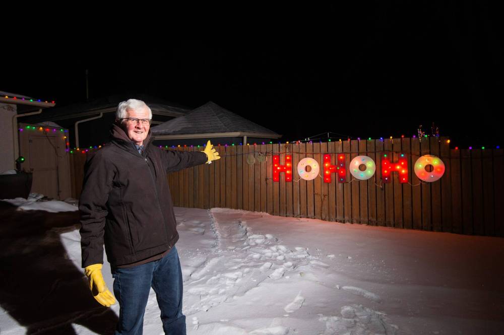 Mike Sudoma / Winnipeg Free Press
Sid Farmer shows off his “Hohoho” light display, which is a contrast to his father Sid’s famous “Humbug” light display.