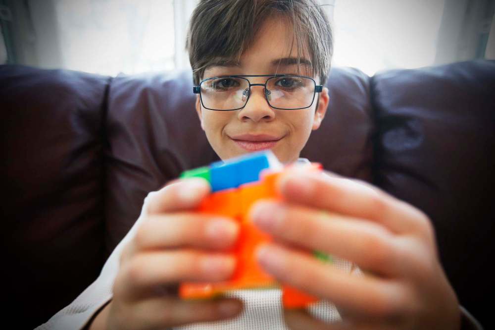 JOHN WOODS / WINNIPEG FREE PRESS Eleven year old Keith Wierchx, a puzzle and Rubik’s Cube wizard who will be competing in the North American championship in Toronto in June, is photographed in his Winnipeg home Sunday, January 12, 2020. Wierchx’s average puzzle completion time is 18 seconds. This year is the 40th anniversary of the challenging puzzle cube. Reporter: ?