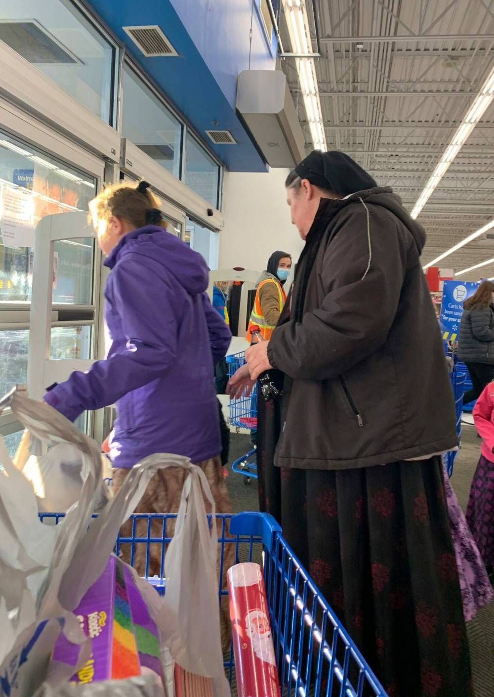 Madison Ushakas / Twitter
Maskless patrons at Walmart in Winkler on Saturday.