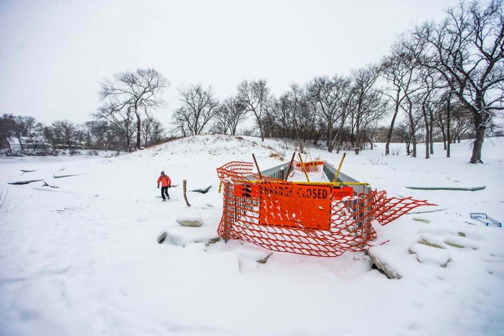 Crews blocked access in early December, after high waters in late November flooded the bridge and nearby paths and froze over. (Mikaela MacKenzie / Free Press files)