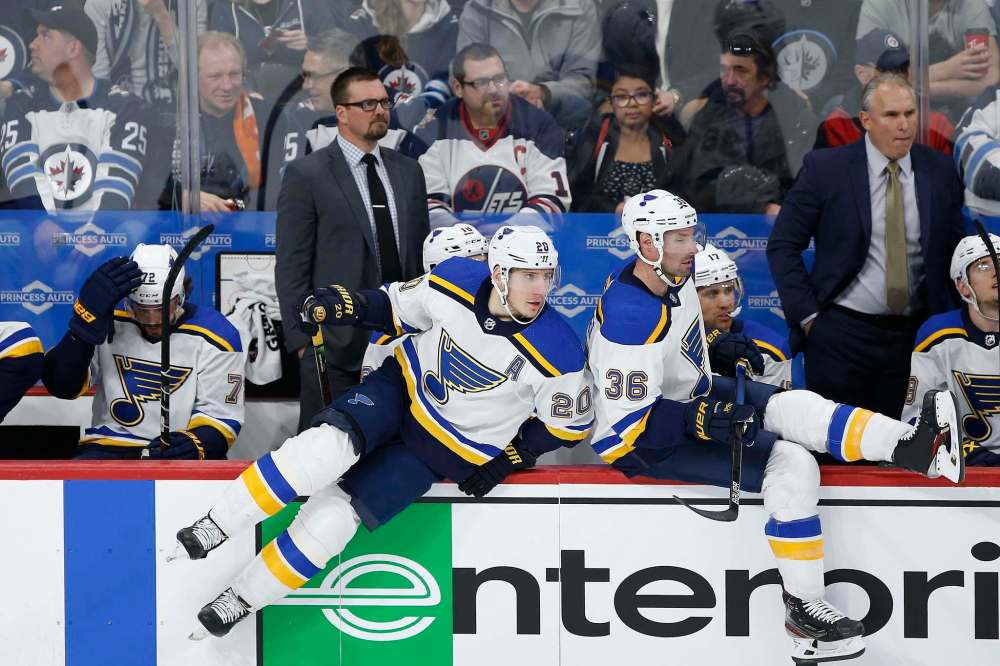 THE CANADIAN PRESS/John Woods
St. Louis Blues' Alexander Steen, left, heads over the boards against Winnipeg Jets during the first period in Winnipeg last Saturday. Steen was playing his 1,000 NHL game.