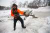 JOHN WOODS / WINNIPEG FREE PRESS FILES
Brad Hignell, pictured, and Wolseley resident Chris Beauvilain shovelled the snow and ice from the Omand’s Creek bridge after the city closed it to pedestrians in December.