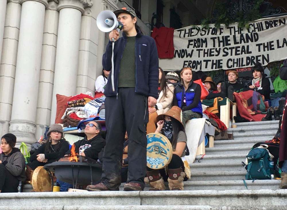 THE CANADIAN PRESS/Dirk Meissner
Indigenous pipeline protester Kolin Sutherland-Wilson speaks at an anti-pipeline rally in Victoria, Saturday, Feb.8, 2020. Protesters supporting efforts by Wet’suwet’en hereditary chiefs to stop the natural gas pipeline lit a ceremonial fire at the legislature. About 300 people gathered for the protest.