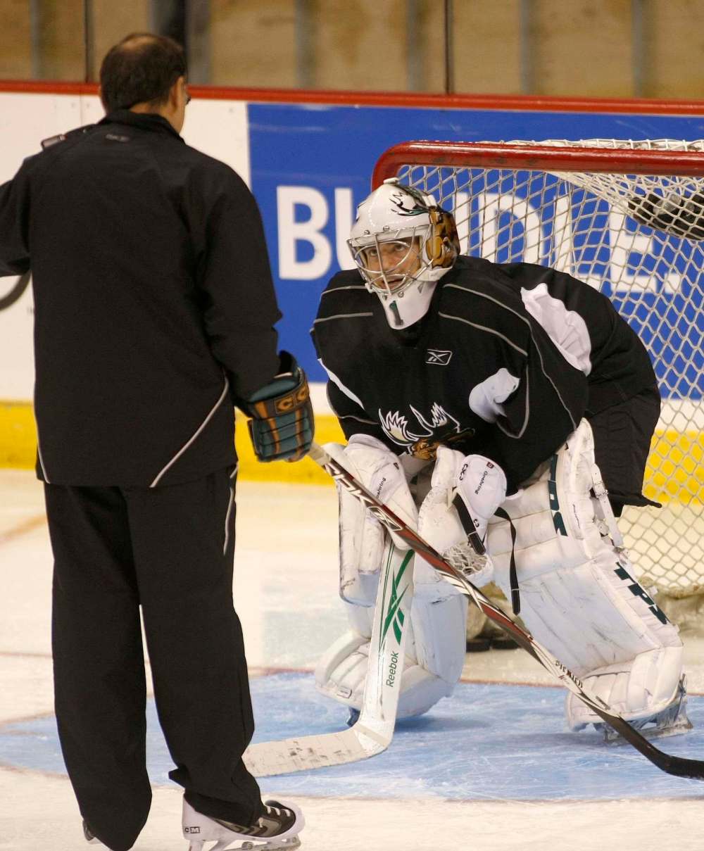 St. Croix works with goaltender Karl Goehring at a practice in 2008. (Joe Bryksa / Free Press files)
