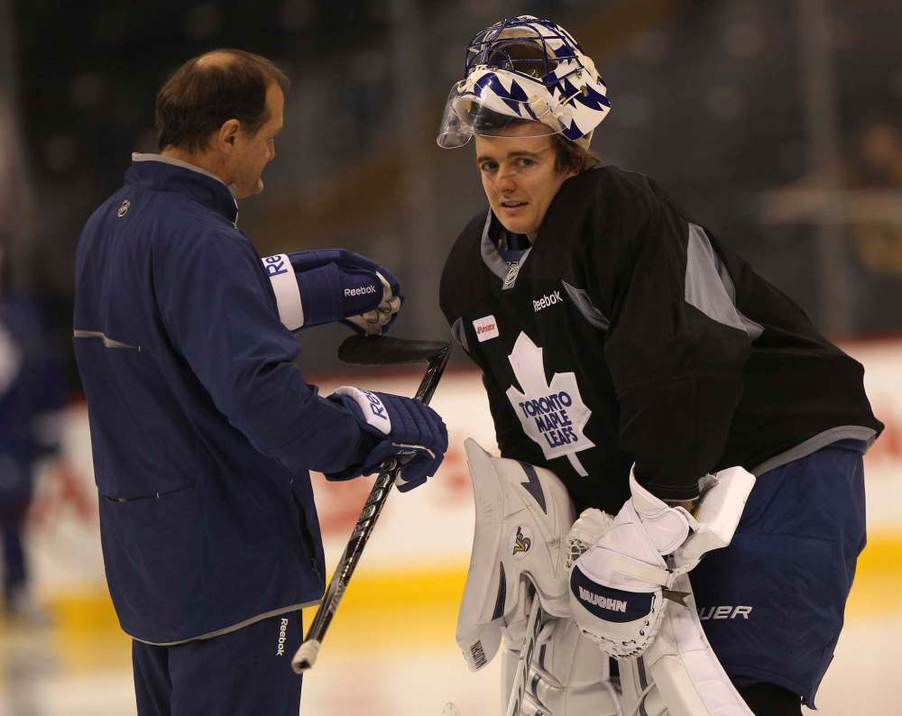 St. Croix chats with goaltender Ben Scrivens during practice in 2013 (Joe Bryksa / Free Press files)