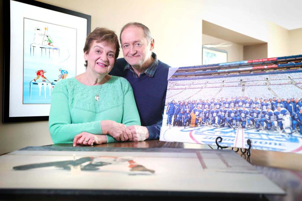 St. Croix with his wife Michelle and some of the memorabilia from his NHL career. (Ruth Bonneville / Winnipeg Free Press)
