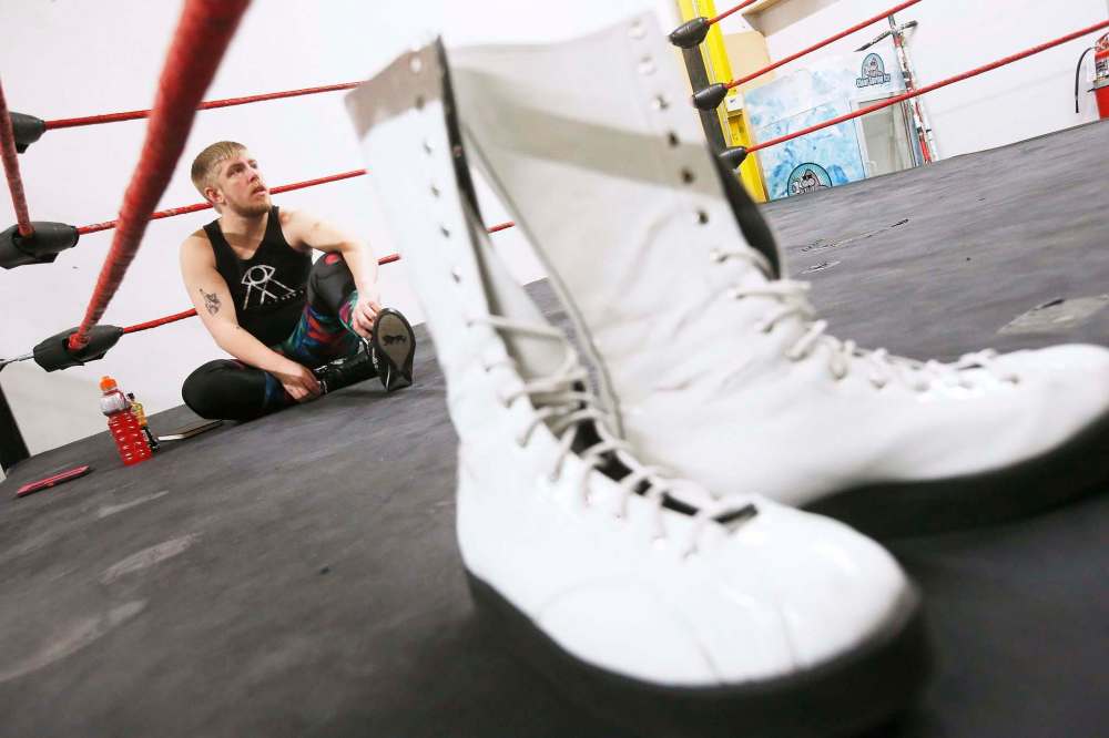 A pair of wrestling boots sit ringside as Winnipegger George Hudson, a.k.a. Dash Royal, warms up. (John Woods / Winnipeg Free Press)