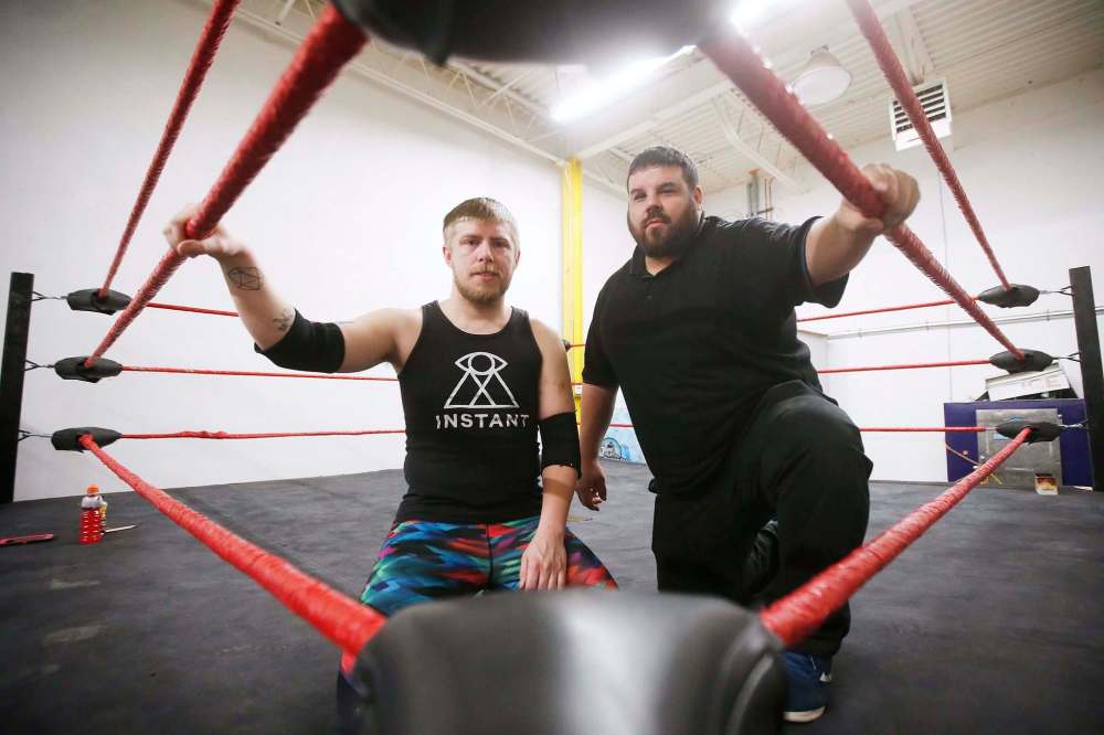 Wrestlers A.J. Sanchez (right), a.k.a. The Canadian Crusher, and George Hudson, a.k.a. Dash Royal, during a training session. (John Woods / Winnipeg Free Press)