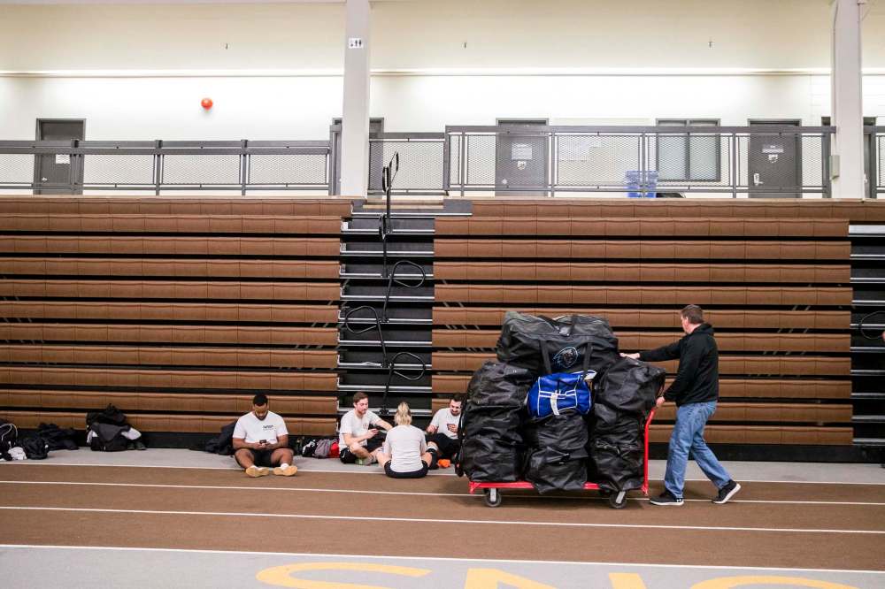 Equipment manager Darcy Ewanchuk loads gear from the van to the locker room at the Wayne Fleming Arena.