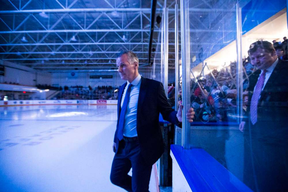 Head coach James Patrick steps out onto the ice during the pre-game ceremonies.