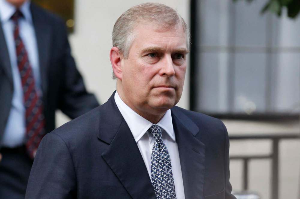 Photo of Britain's Prince Andrew have been published of the Queen's son at Nygard's Bahamas estate in 2000. Prince Andrew was also a friend of Jeffrey Epstein, who was accused of running a sex trafficking ring before he committed suicide while awaiting trial. (Sang Tan / The Associated Press files