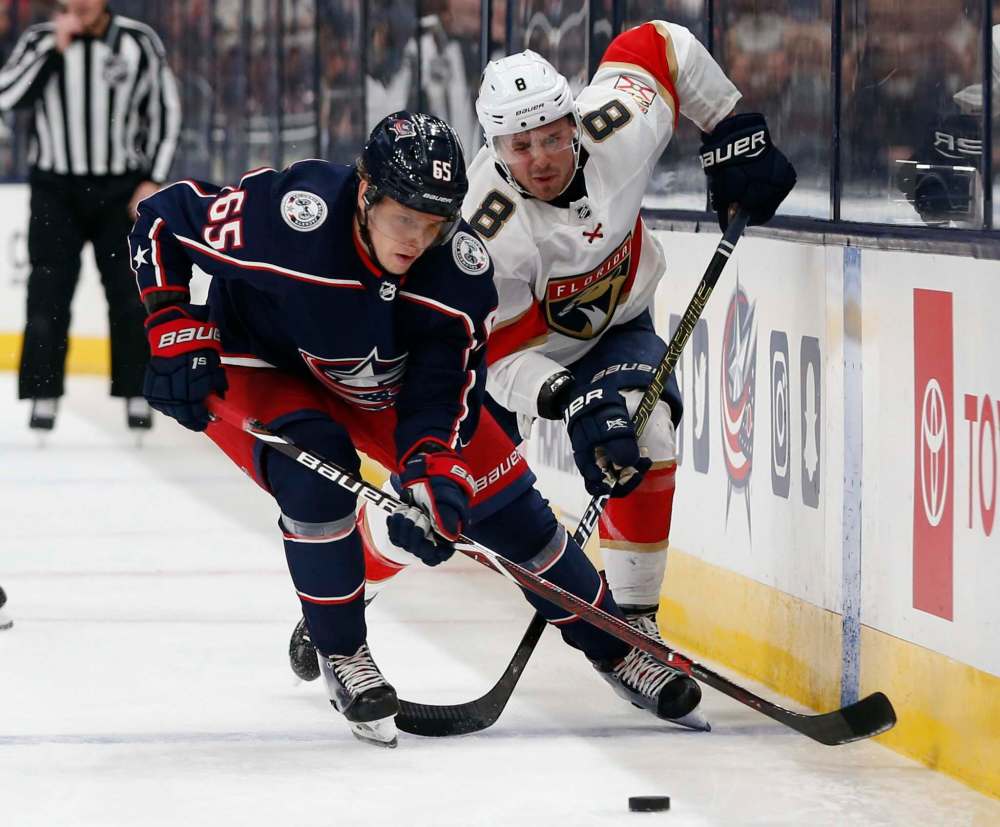 Jayce Hawryluk (right) battles Markus Nutivaara earlier this month in Columbus, Ohio. (Jay LaPrete / Associated Press files)